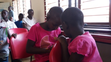 Children at the SOS Children's Village Entebbe sharing.